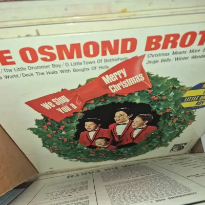 Sale Photo Thumbnail #757: Vintage The Osmond Brothers 'We Sing You a Merry Christmas' vinyl LP record album, released by Metro Records.