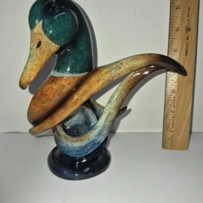 Sale Photo Thumbnail #278: Stylized glazed ceramic mallard duck figurine, standing approximately 8 inches tall.