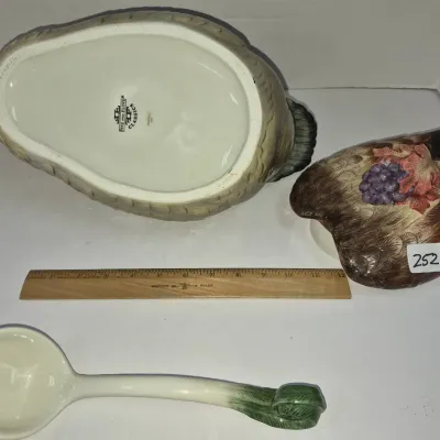 Sale Photo Thumbnail #430: Fitz and Floyd Classics ceramic duck-shaped tureen with lid and matching ladle, shown with a ruler for scale.