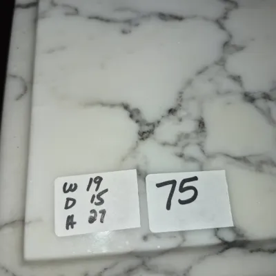 Sale Photo Thumbnail #118: White marble tabletop featuring grey veining, shown with price and dimension tags.