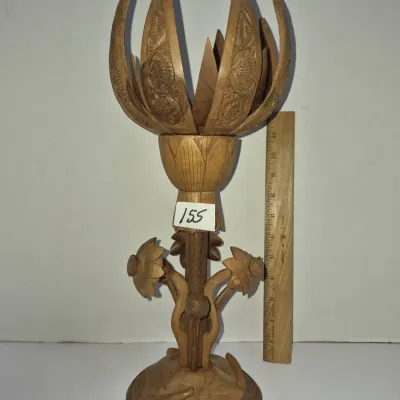 Sale Photo Thumbnail #269: Hand-carved wooden lotus candle holder or decorative sculpture featuring detailed petal designs and floral accents.