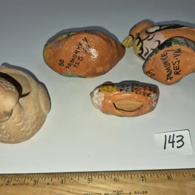 Sale Photo Thumbnail #243: Four vintage Pamunkey Reservation pottery bird figurines, including hand-painted terracotta pieces and a carved clay bowl, signed on the underside.
