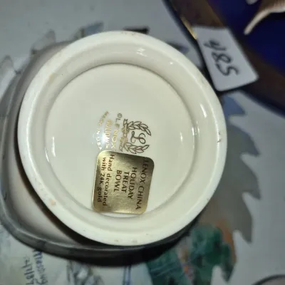 Sale Photo Thumbnail #833: Underside of a Lenox China Holiday Treat Bowl featuring gold factory backstamp and original foil sticker.