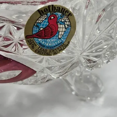 Sale Photo Thumbnail #232: Close-up of a Hofbauer West German cut lead crystal dish featuring ruby stain accents and an original manufacturer sticker.