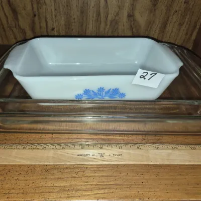 Sale Photo Thumbnail #43: Vintage Corning Ware white milk glass loaf pan with blue floral motif, sitting inside a clear glass baking dish.