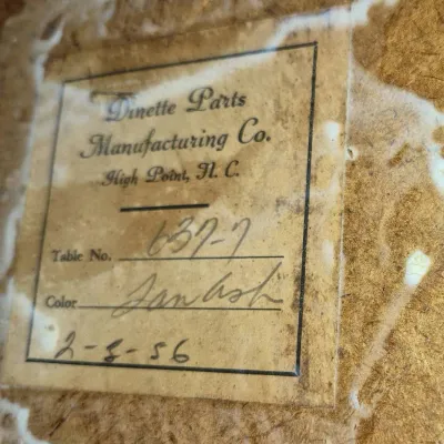 Sale Photo Thumbnail #843: Original Dinette Parts Manufacturing Co. manufacturer label attached to a piece of furniture, dated February 8, 1956.