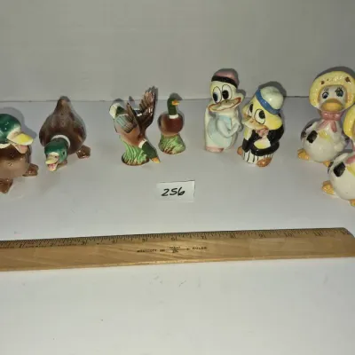 Sale Photo Thumbnail #437: Collection of vintage ceramic duck figurines and salt and pepper shakers in various realistic and anthropomorphic styles.