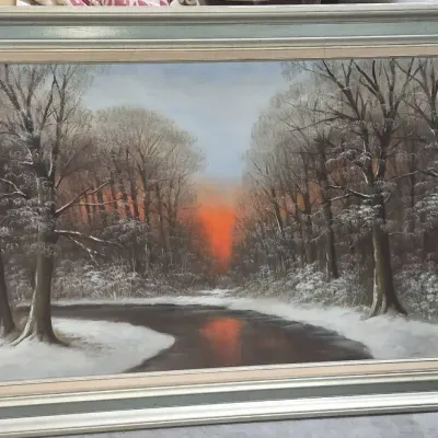 Sale Photo Thumbnail #489: Large framed mid-century landscape painting depicting a snow-covered forest path at sunset, signed in the lower right corner.