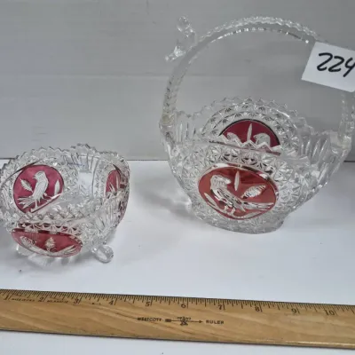 Sale Photo Thumbnail #386: Two pieces of Hofbauer Byrdes pattern pressed crystal, including a footed bowl and a handle basket with ruby stained bird medallions.