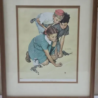 Sale Photo Thumbnail #524: Framed Norman Rockwell print titled 'Knuckles Down', depicting children playing marbles, housed in a double-matted wooden frame.