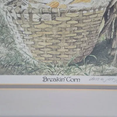 Sale Photo Thumbnail #487: Framed art print titled "Breakin' Corn" by Dona and Jerry Locklair, featuring a signature on the lower right margin.