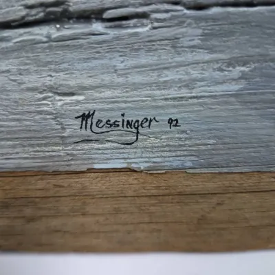 Sale Photo Thumbnail #605: Artist signature 'Messinger 92' on a textured grey surface, likely a painting on wood or textured canvas.