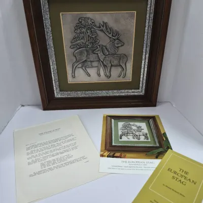 Sale Photo Thumbnail #590: Framed Franklin Mint "The European Stag" silver relief sculpture by Donald Richard Miller, complete with original certificates and documentation.