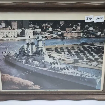 Sale Photo Thumbnail #526: Framed vintage photograph of the USS North Carolina (BB-55) battleship, measuring 23 by 18 inches.
