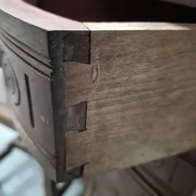 Sale Photo Thumbnail #169: Detail shot of dovetail joinery on a wood drawer, highlighting traditional furniture construction.