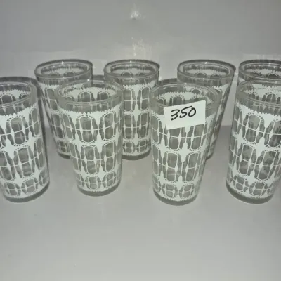 Sale Photo Thumbnail #611: Set of eight vintage mid-century drinking glasses featuring a white printed lace pattern.