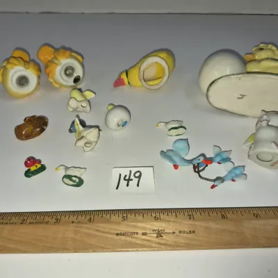 Sale Photo Thumbnail #255: Collection of vintage miniature bird figurines and ceramic duck salt and pepper shakers.