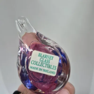 Sale Photo Thumbnail #223: Blarney Glass Collectibles hand-blown art glass bird figurine featuring purple and pink internal accents, made in Ireland.