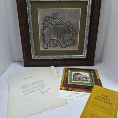 Sale Photo Thumbnail #587: Franklin Mint 'The Indian Elephant' framed silver wall sculpture by Donald Richard Miller, complete with original paperwork and booklet.