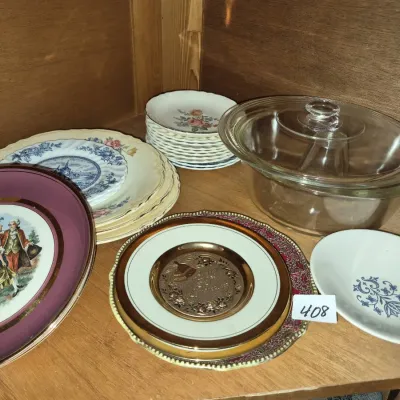 Sale Photo Thumbnail #720: Collection of assorted vintage tableware, including decorative cabinet plates, floral saucer sets, and a covered clear glass casserole dish.