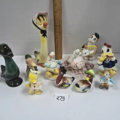 Sale Photo Thumbnail #463: Collection of vintage ceramic duck figurines, featuring various whimsical characters, long-neck goose, and salt and pepper shaker styles.