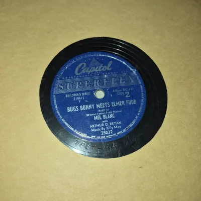 Sale Photo Thumbnail #754: Vintage Capitol Superflex 78 RPM record, 'Bugs Bunny Meets Elmer Fudd' featuring Mel Blanc, housed in a paper sleeve.