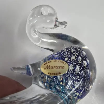 Sale Photo Thumbnail #224: Vintage Murano art glass duck figurine featuring clear glass with a blue and silver flecked interior, bearing the original "Made in Italy Murano Venezia" foil label.