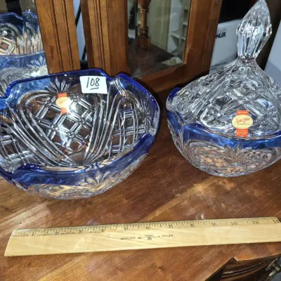 Sale Photo Thumbnail #175: Anna Hütte lead crystal serving bowl and covered candy dish featuring blue stained rims and intricate diamond cut patterns.