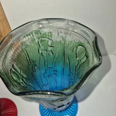 Sale Photo Thumbnail #294: Vintage pressed glass vase featuring a molded iris floral pattern and a blue to green ombre color gradient with a scalloped rim.