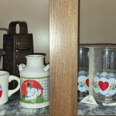 Sale Photo Thumbnail #585: Collection of vintage kitchenware including a pair of Libbey heart-pattern glass sets in original boxes, a ceramic duck canister, a 1974 souvenir mug, and a Bromwell metal grater.