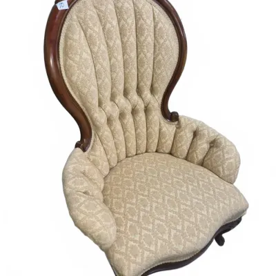 Sale Photo Thumbnail #14: Victorian-style tufted balloon back armchair with carved mahogany frame and beige damask upholstery.