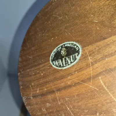 Sale Photo Thumbnail #297: Underside of a vintage mid-century wooden item featuring a original "Genuine American Walnut" foil manufacturer label.