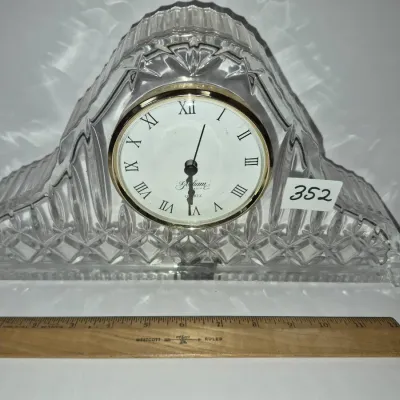 Sale Photo Thumbnail #615: Gorham cut crystal mantel clock with quartz movement and Roman numeral dial, displayed with a ruler for size reference.