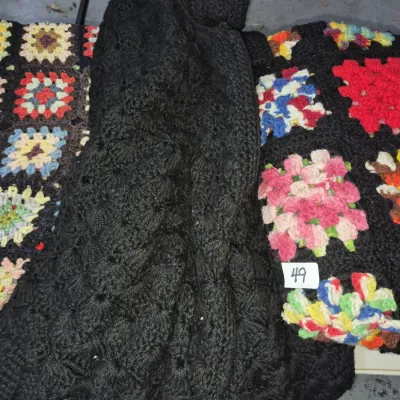 Sale Photo Thumbnail #79: Handmade crochet granny square blankets and a solid black knit piece, circa 1970s.