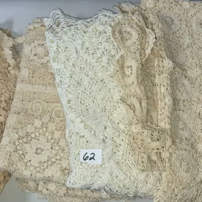 Sale Photo Thumbnail #95: Collection of vintage handmade crocheted lace linens and tablecloths in cream and ecru tones.
