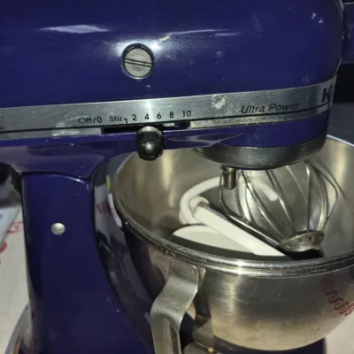Sale Photo Thumbnail #66: Cobalt blue KitchenAid Ultra Power tilt-head stand mixer with a stainless steel bowl and attachment set included.