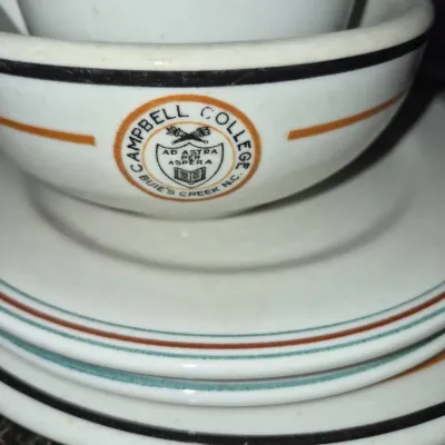 Sale Photo Thumbnail #712: Vintage Campbell College restaurantware dish stack, featuring the Buies Creek, North Carolina school crest and colored trim.