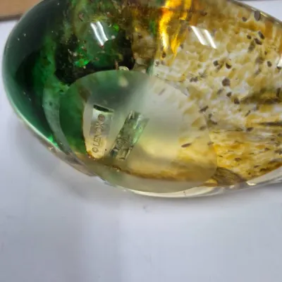 Sale Photo Thumbnail #372: Lenox art glass paperweight featuring swirl patterns in green, gold, and white, with the maker's mark etched on the base.