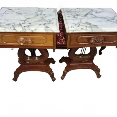 Sale Photo Thumbnail #116: Pair of traditional carved wood end tables with white marble tops, rose-motif drawer pulls, and lyre-style pedestal bases.