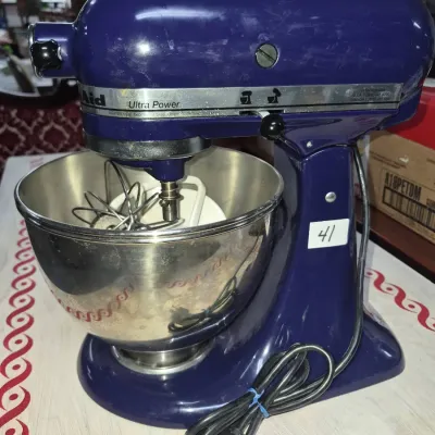 Sale Photo Thumbnail #64: KitchenAid Ultra Power tilt-head stand mixer in cobalt blue, complete with stainless steel mixing bowl, wire whisk, and flat beater attachments.