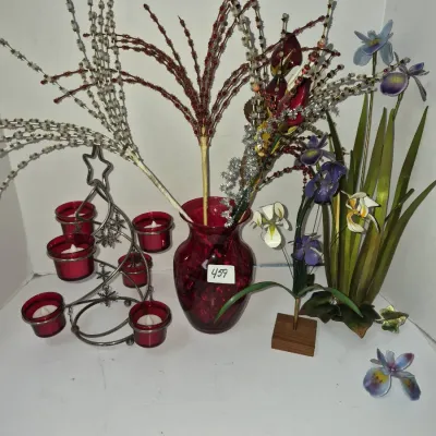 Sale Photo Thumbnail #794: Holiday tabletop decor group featuring a ruby red glass vase with beaded floral picks, a tree-shaped candle holder with red votive cups, and decorative artificial iris arrangements.