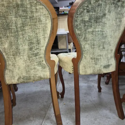 Sale Photo Thumbnail #112: Pair of Victorian-style dining chairs with carved wood frames and green crushed velvet upholstery with braided gimp trim.