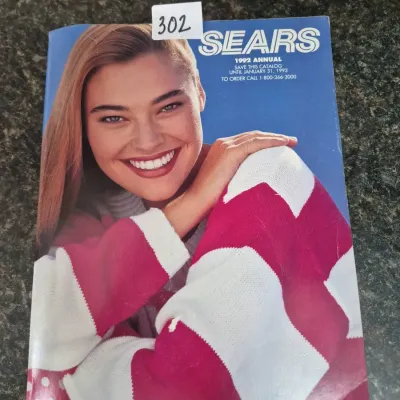 Sale Photo Thumbnail #536: Vintage 1992 Sears Annual mail-order catalog featuring a cover model in a pink and white sweater.