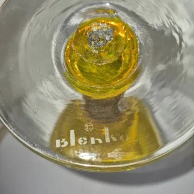 Sale Photo Thumbnail #306: Bottom view of a vintage Blenko hand-blown art glass vessel featuring an amber accent and sandblasted 'Blenko' maker's mark.