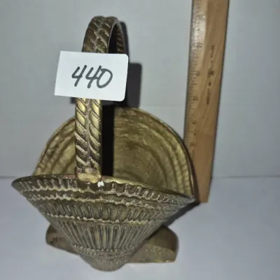 Sale Photo Thumbnail #764: Vintage brass mini scuttle-style basket with braided handle and ornate relief patterns, shown next to a ruler for scale.