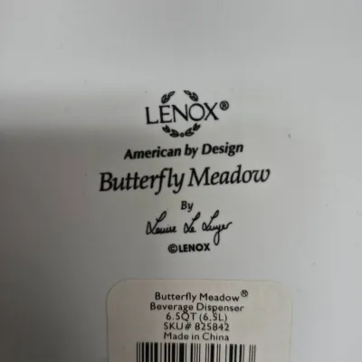 Sale Photo Thumbnail #163: Maker's mark and retail sticker on the bottom of a Lenox Butterfly Meadow 6.5-quart beverage dispenser designed by Louise Le Luyer.
