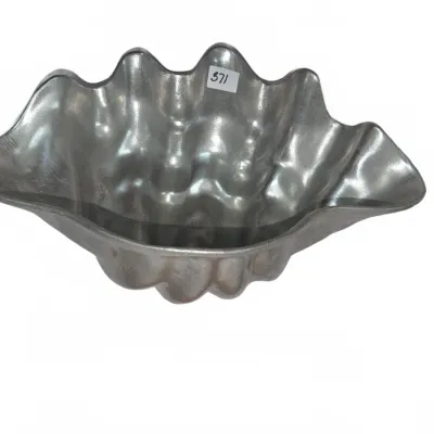 Sale Photo Thumbnail #644: Cast aluminum clam shell decorative serving bowl with a polished silver finish.