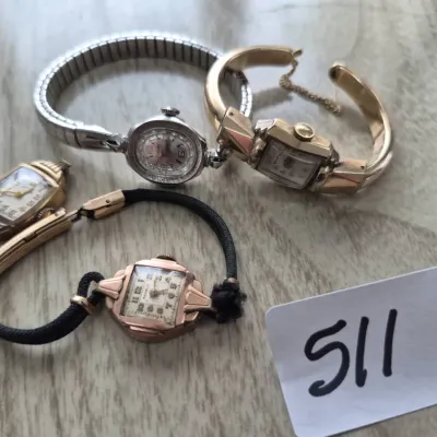 Sale Photo Thumbnail #879: Collection of four vintage ladies' wristwatches, including silver-tone and gold-filled Art Deco and mid-century styles with expansion, cord, and bangle bands.