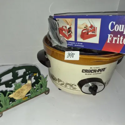 Sale Photo Thumbnail #700: Vintage Rival Crock-Pot slow cooker with a boxed Coupe Frites french fry cutter and a cast iron duck-motif napkin holder.