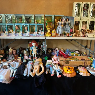 Large collection of vintage Wizard of Oz memorabilia, including boxed and loose dolls, character masks, figurines, and collectibles...